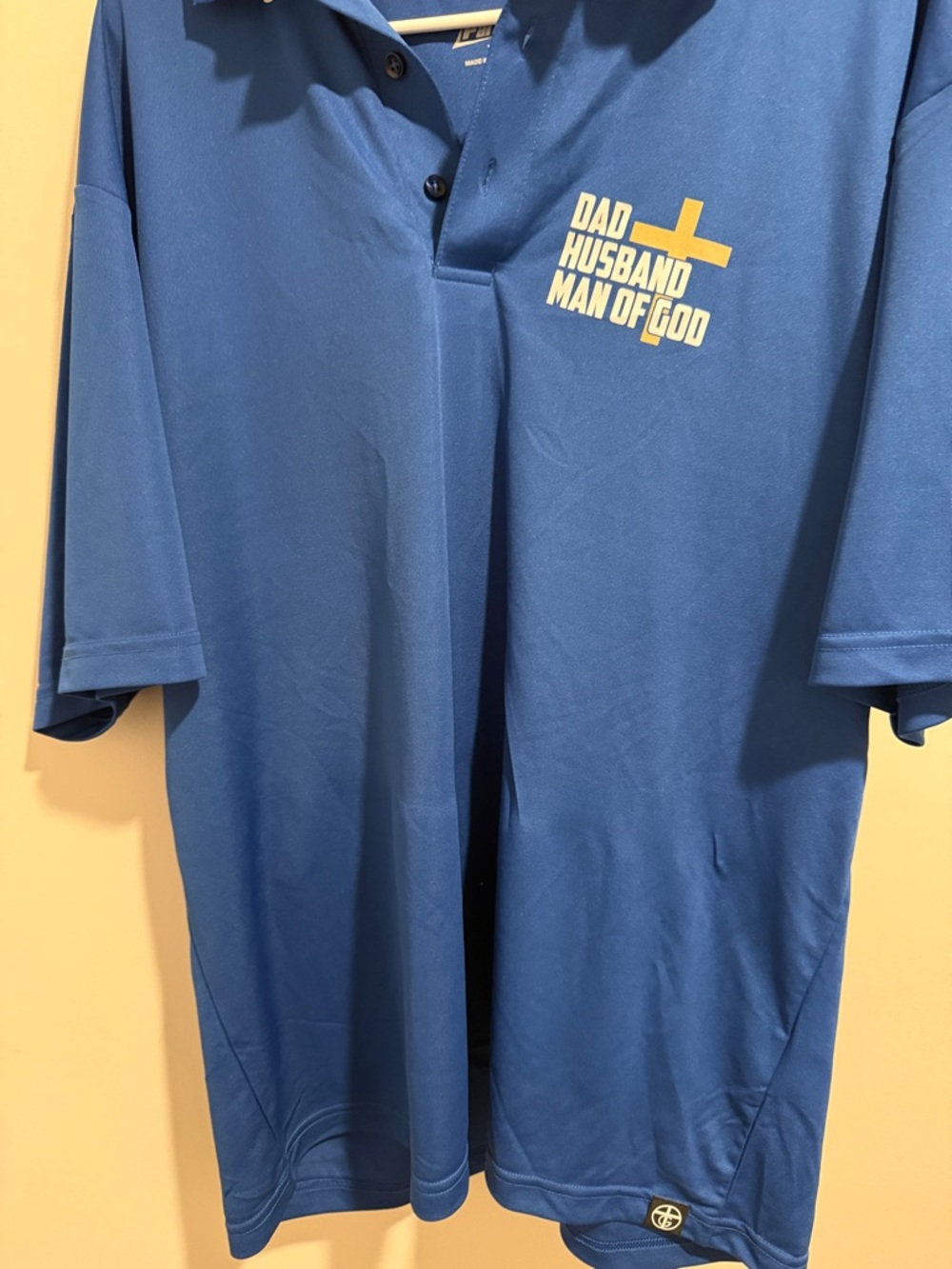 PARAGON Blue Polo with Yellow Cross Graphic